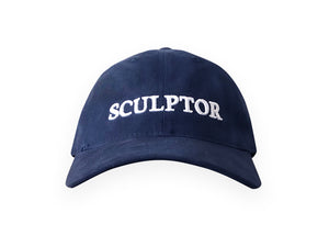 Image of navy hat with SCULPTOR embroidered in white on front