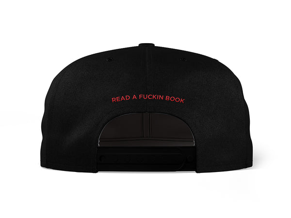 Image of the back of a black 5-panel snapback hat, embroidered with "READ A FUCKIN BOOK" in red text.