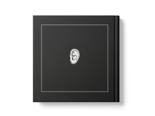 Image of a black, square book's back cover with a white illustration of an ear, on a white background.