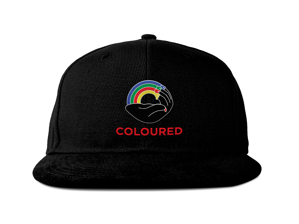 Image of the front of a black 5-panel snapback hat, embroidered with the Coloured Publishing logo and "COLOURED" in red text.