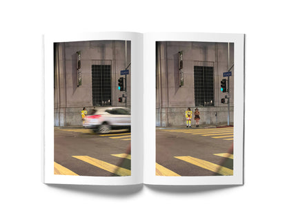 Image of a book open to a spread. On the left page is a photograph of a car speeding past and on the right page is a photograph of a person in a Spongebob Squarepants costume next to a person in a witch costume.