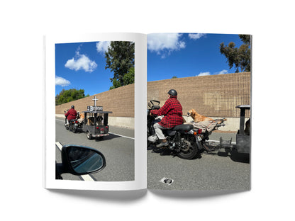 Image of a book open to a spread. On the left page is a photograph of a freeway and on the right page is a photograph of a freeway.
