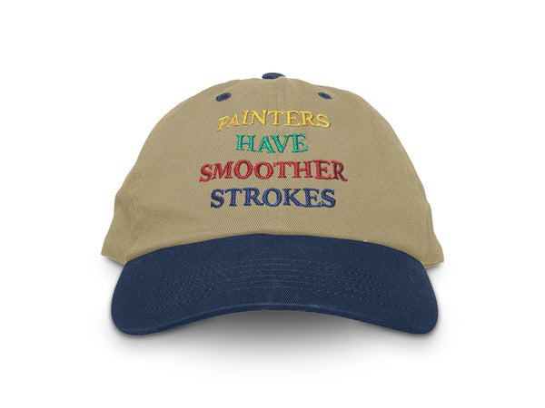 Image of front of khaki hat with blue bill, with "Painters have smoother strokes" embroidered in yellow, green, red, and blue