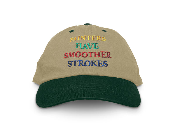 Image of front of khaki hat with green bill, with "Painters have smoother strokes" embroidered in yellow, green, red, and blue