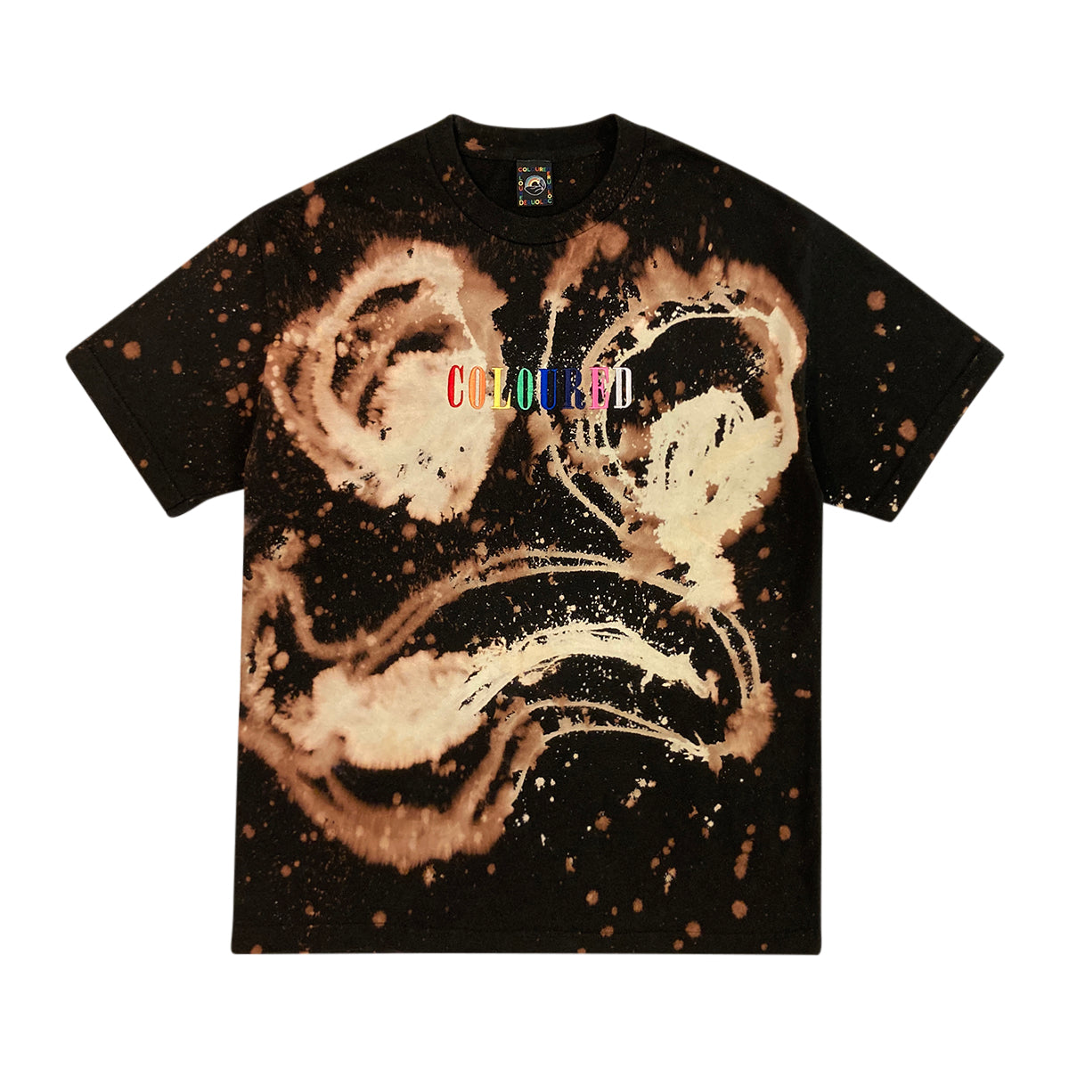 An image of a black t-shirt with a face in beige and "COLOURED" embroidered in rainbow colors.