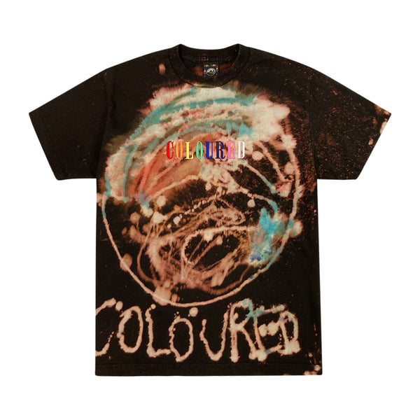 An image of a black t-shirt with the Coloured Publishing logo bleached and dyed on, with "COLOURED" written on the bottom and "COLOURED" embroidered in rainbow colors.