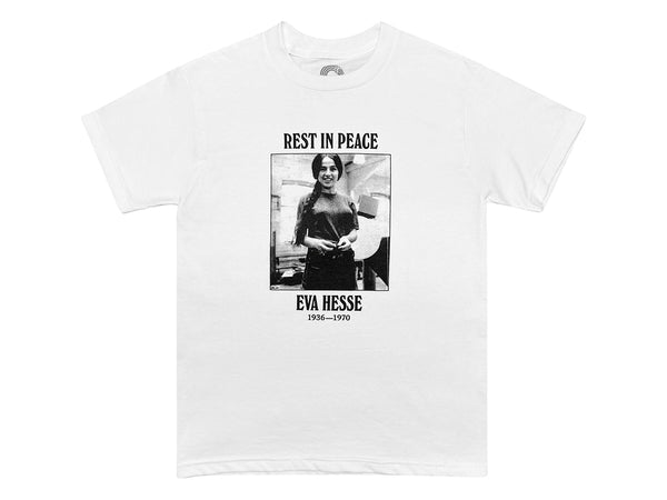 An image of a white t-shirt with a black and white photograph of Eva Hesse with text that reads "REST IN PEACE EVA HESSE 1936-1970"  