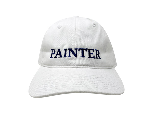 An image of the front of a white hat with "PAINTER" embroidered in navy.