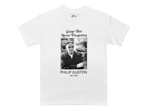 An image of a white t-shirt with a black and white photograph of Philip Guston with text that reads "Gone But Never Forgotten Philip Guston 1913-1980"