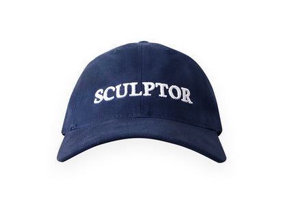 Image of navy hat with SCULPTOR embroidered in white on front