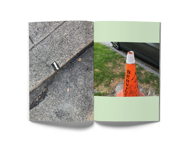 Image of a spread from the book "Street Snacks." The lefthand page is a full-bleed image of a cigarette butt in a notch in a curb; the righthand page is a photo of a styrofoam cup wedged onto the tip of a traffic cone.