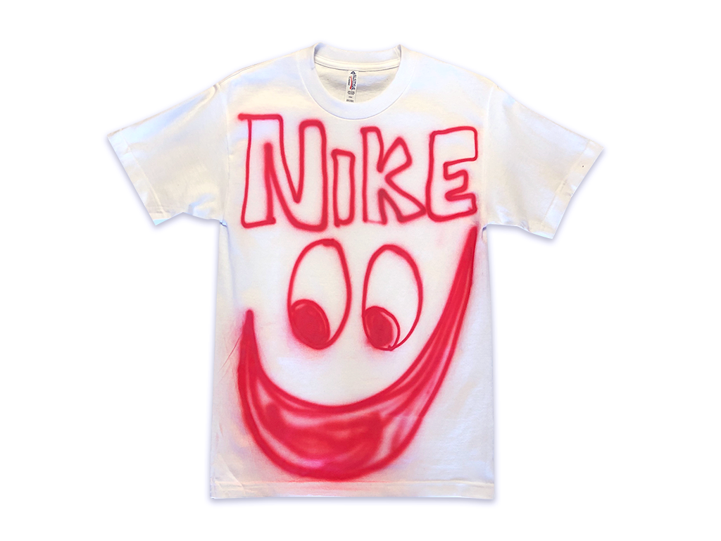 Photo of an airbrushed t-shirt with "Nike" above a smiley face by artist Devin Troy Strother.