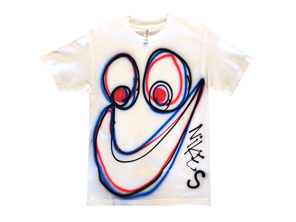 Photo of an airbrushed t-shirt with a smiley face and the word "Nikes" by artist Devin Troy Strother. 