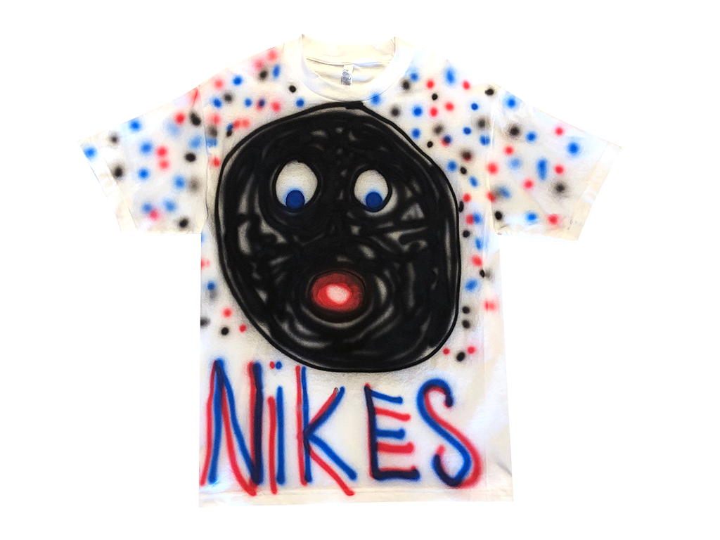 Photo of an airbrushed t-shirt with a smiley face and the word "Nikes" by artist Devin Troy Strother.