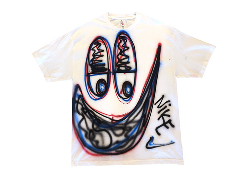 Photo of an airbrushed t-shirt with a smiley face by artist Devin Troy Strother.